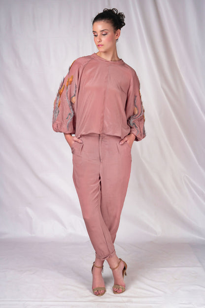 Women's top on muted tones and textured embroidery to compliment over balloon sleeves