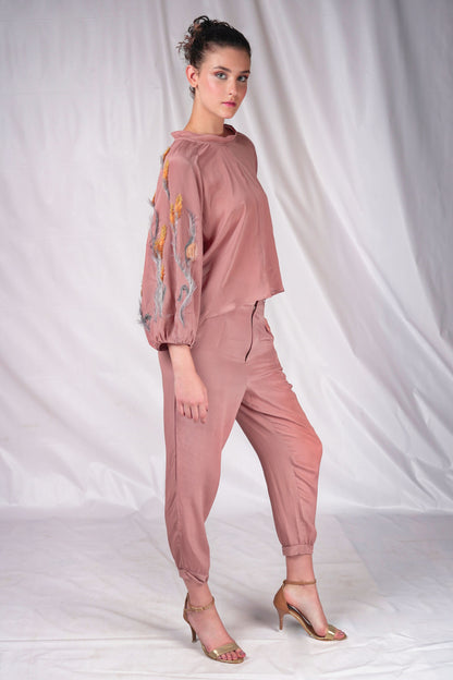 Women's top on muted tones and textured embroidery to compliment over balloon sleeves