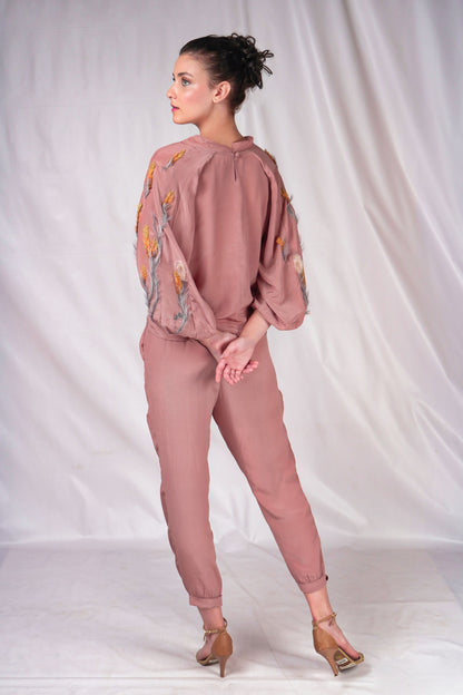 Women's top on muted tones and textured embroidery to compliment over balloon sleeves